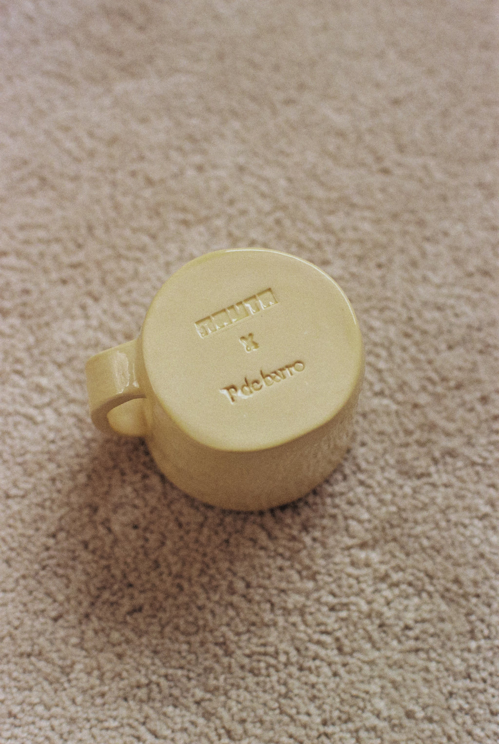 Yellow ceramic mug with phrase