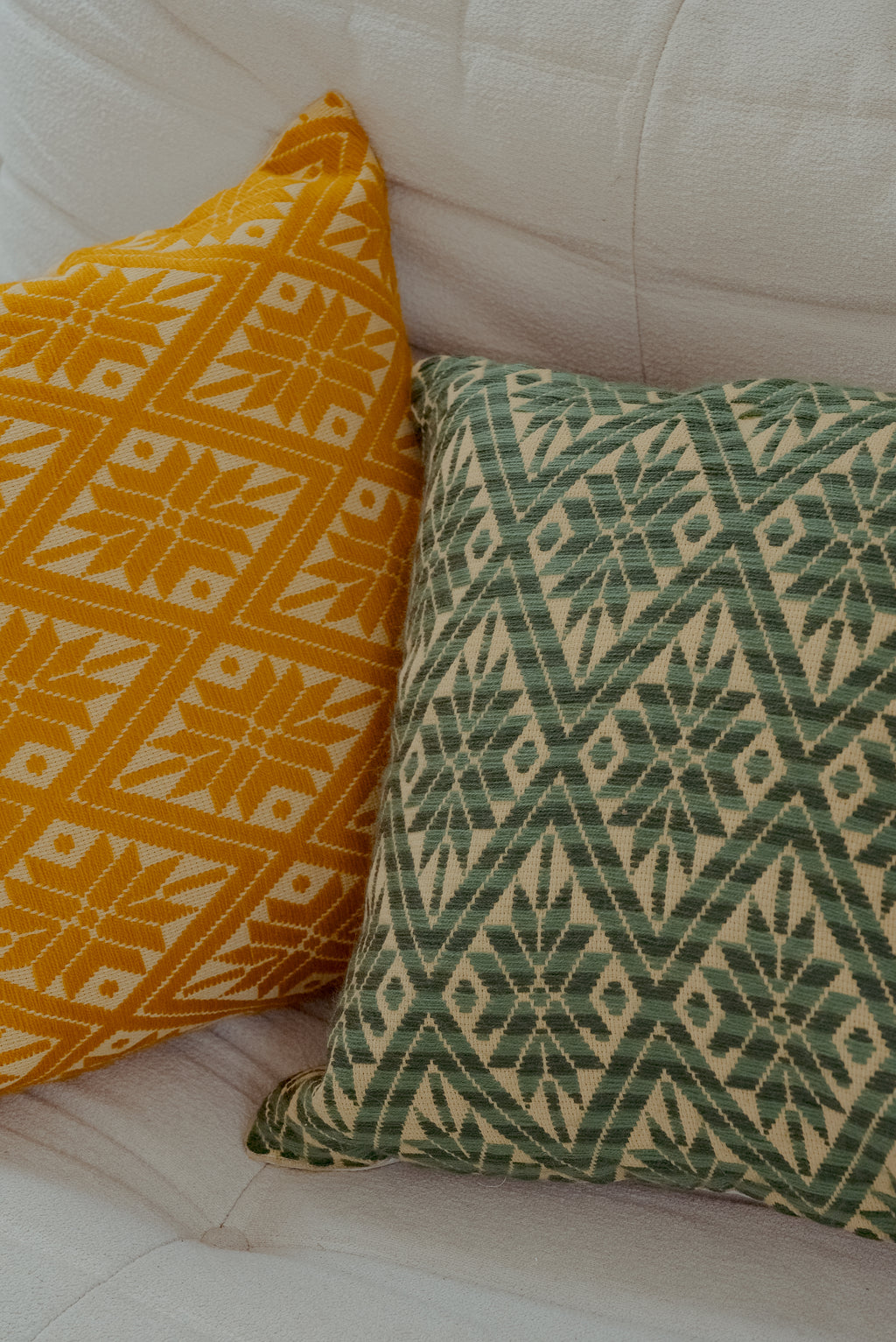 Cushion with embroidered green cover