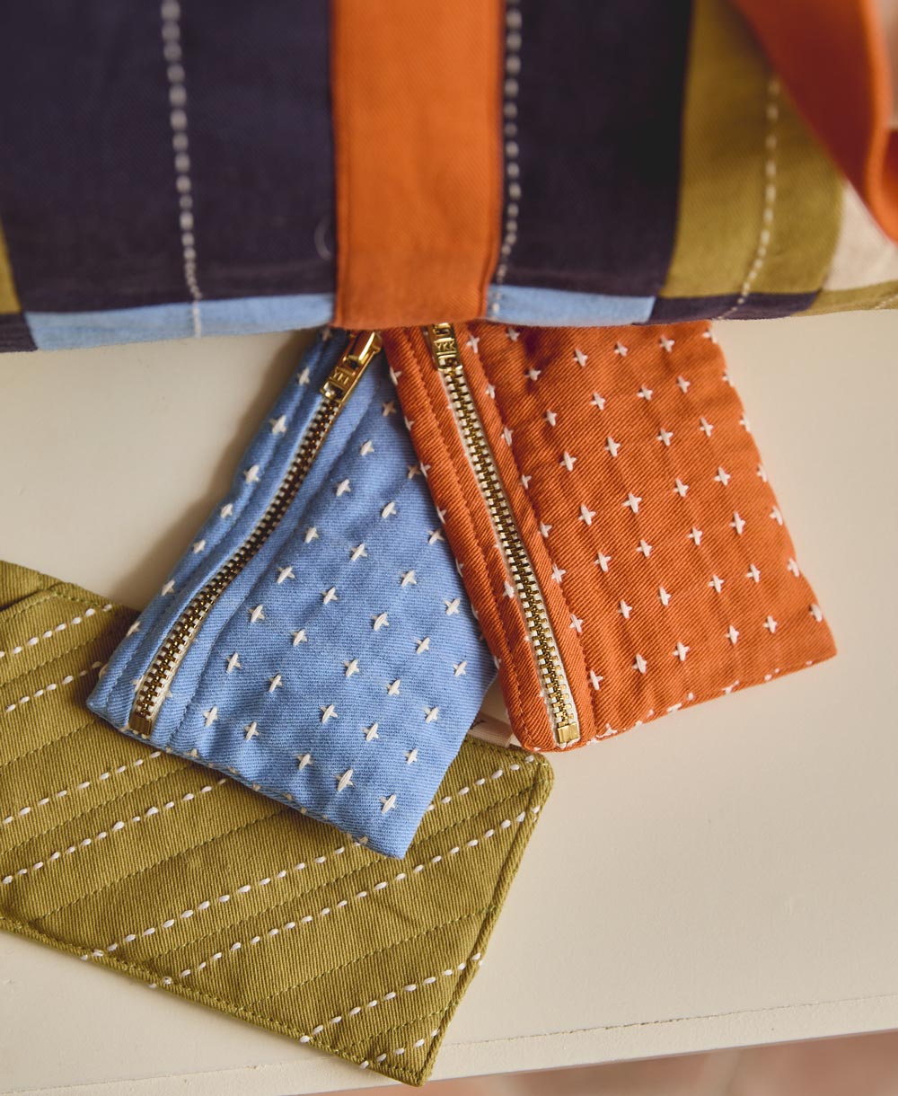 Monederos Cross-Stitch en tonos naranja, azul y verde